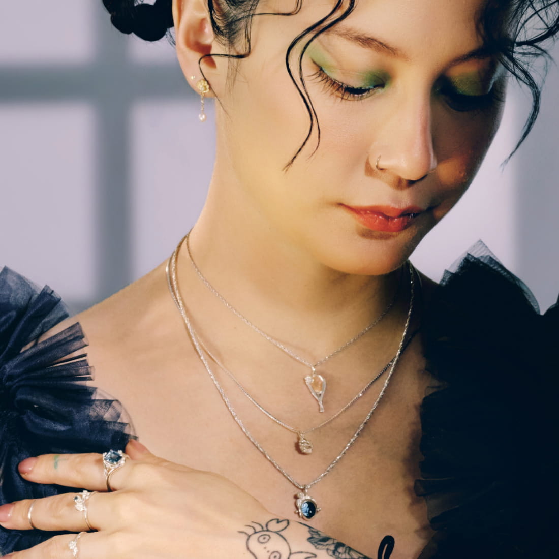 Michelle Zauner wearing jewelry from her second and final collection with Catbird, Magic Mountain